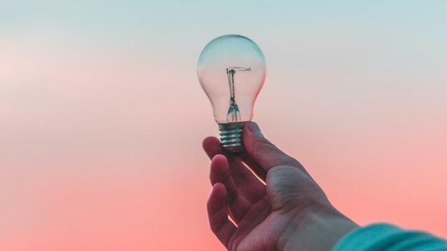 holding lightbulb